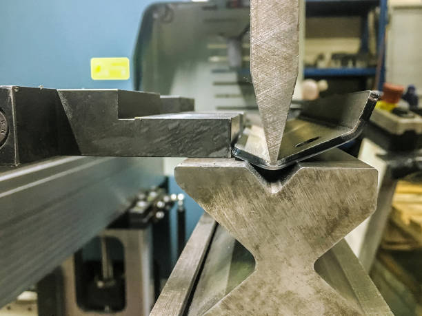 A strut fitting being formed on a press brake